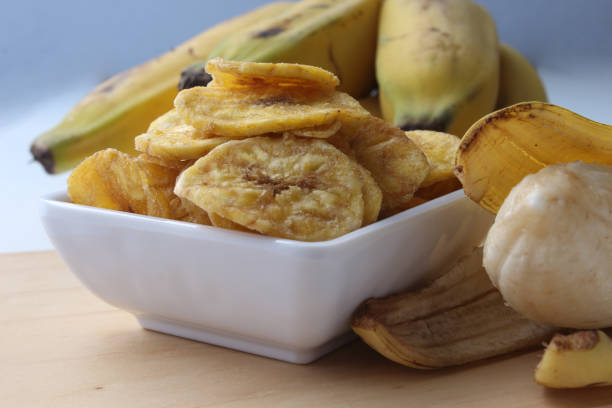 istock Portion of delicious banana chips. 1958820546