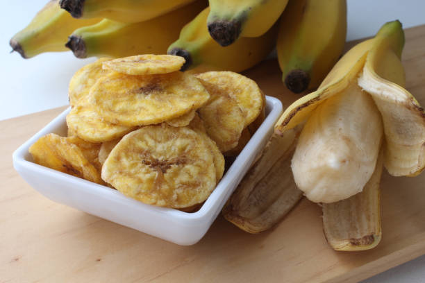 istock Portion of delicious banana chips. 1958820549