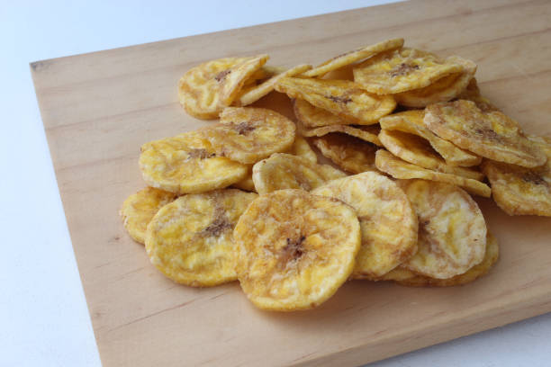 istock Portion of delicious banana chips. 1958821061