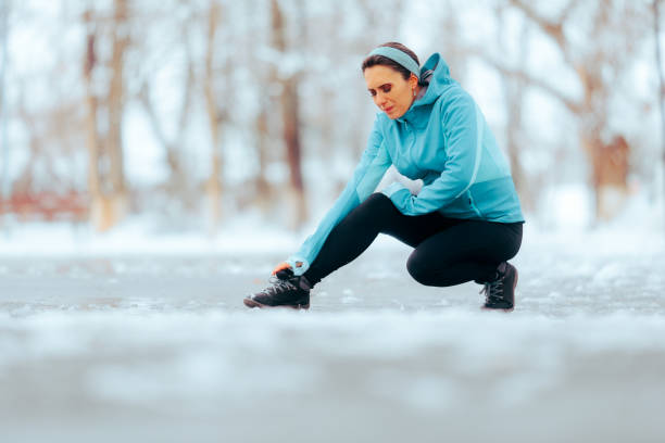 istock Sad Woman Hurting her Ankle During a Running Session in Wintertime 1958835533