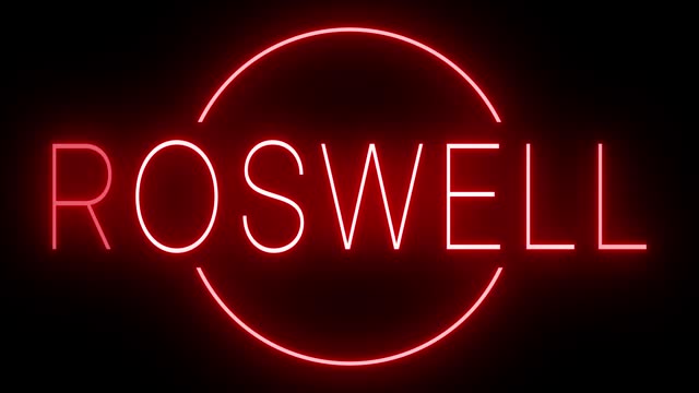 Glowing and blinking red retro neon sign for ROSWELL