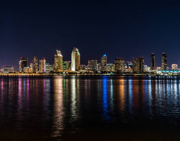 istock City skyline reflecting over water at night 1958842196
