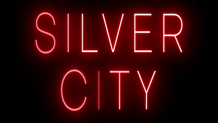 Glowing and blinking red retro neon sign for SILVER CITY