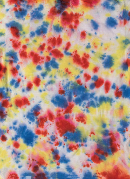 istock White cotton fabric dyed in tie dye style. 1958857279