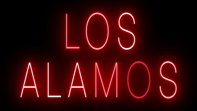 Glowing and blinking red retro neon sign for LOS ALAMOS