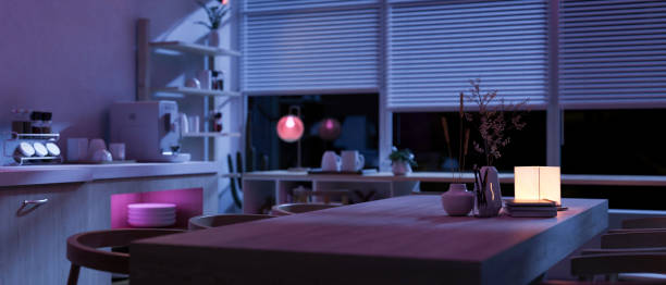 istock A hardwood kitchen dining table in a modern spacious kitchen at night with RGB lights. 1958889156