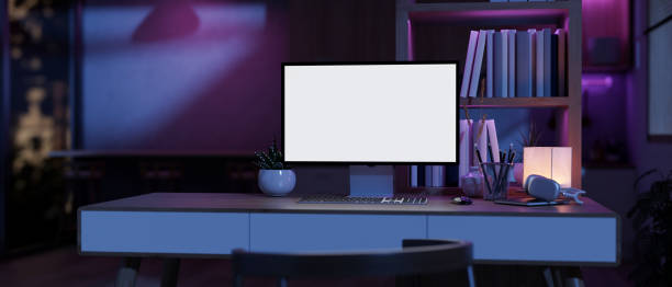 istock A modern futuristic home office workspace with a computer on a table and neon purple dimly lit. 1958889667