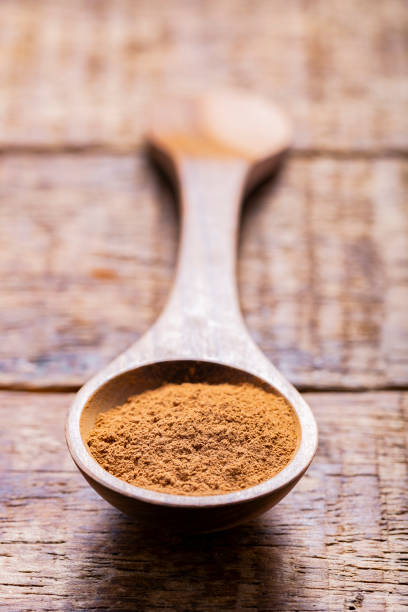 istock Splinters, powder and essence of cinnamon, on the old table 1958917704