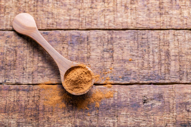 istock Splinters, powder and essence of cinnamon, on the old table 1958918256
