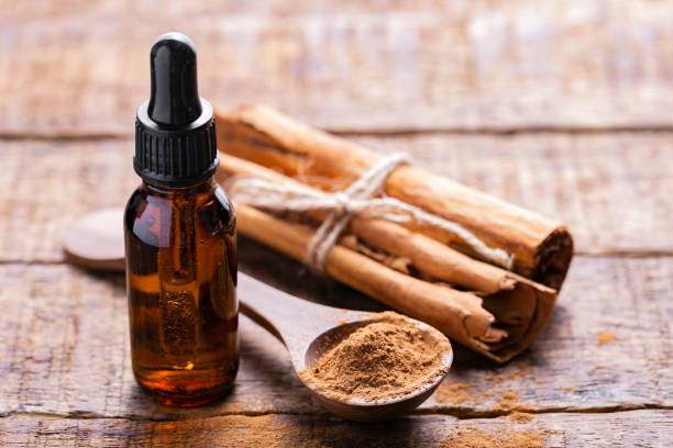 istock Splinters, powder and essence of cinnamon, on the old table 1958918262