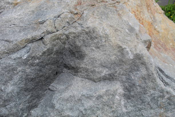 Close-up of gray to red stone surface texture. suitable for background and texture themes.