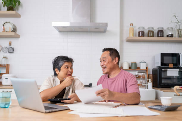istock Happy Asian senior couple use digital technology device to working at home 1959059911