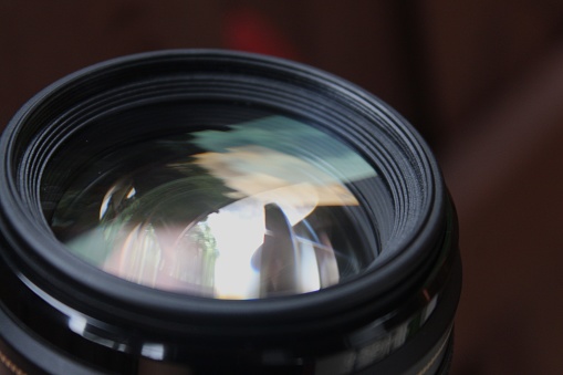 Camera lens close up on a black background