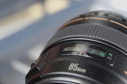 Camera lens close up on a glass table