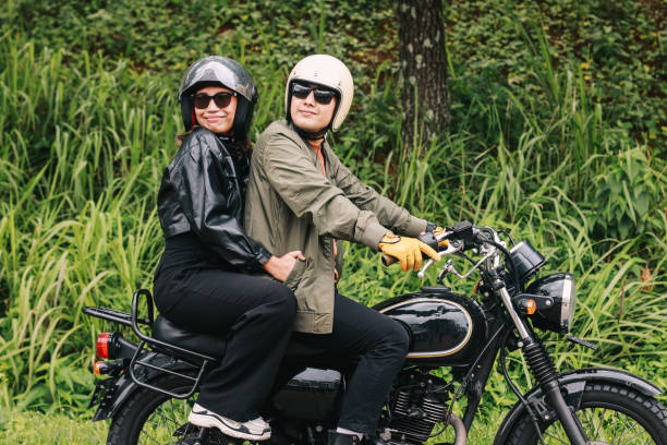 istock Young Couple Riding on Motorbike 1959111604