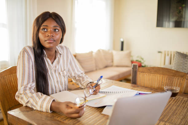 istock Happy young woman is learning online 1959111616