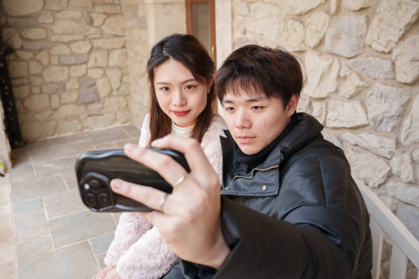 istock Couple taking selfie with smartphone 1959114398