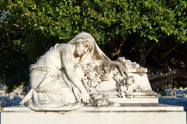 Stone portrait of the Madonna. The gaze is intense, thoughtful, sad and loving. Concept of Christianity, faith, love and advent.