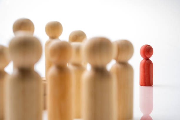 istock Closeup view crowd of wooden figures 1959135064