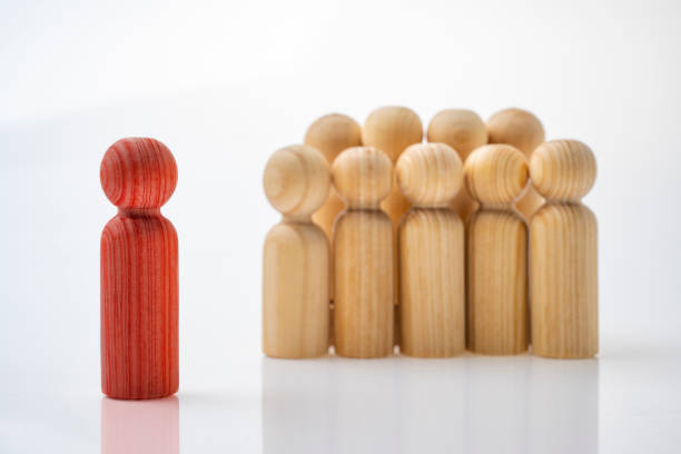 istock Closeup view crowd of wooden figures 1959136089