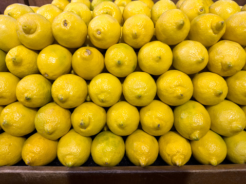 Fresh lemons in a market stall