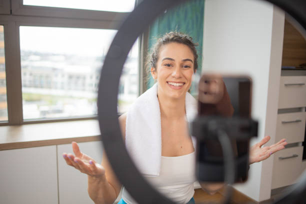 istock Woman is recording a vlog about exercise 1959179753