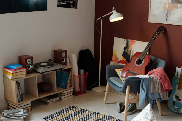 istock New acoustic guitar standing on armchair 1959208363