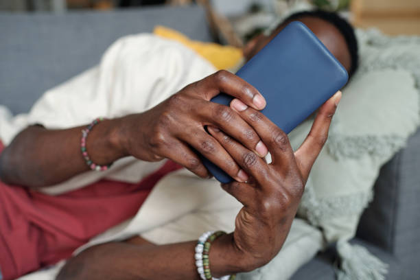 istock Hands of young man with smartphone 1959209413