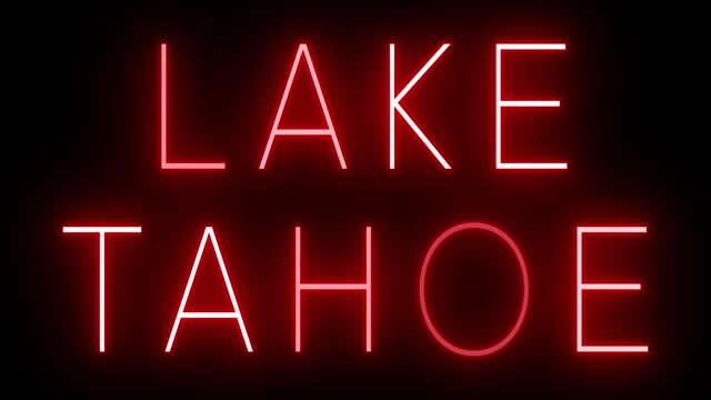 Glowing and blinking red retro neon sign for LAKE TAHOE