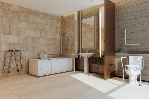 Vista lateral de un baño moderno con bañera, inodoro y lavabo para personas con discapacidad photo