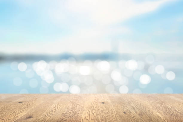 istock Blurred background seen through a wooden table with wood grain, depth background, ocean background image 1959239119