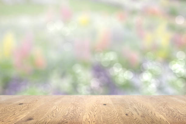 istock Blurred background seen through a wooden table with wood grain, background with depth, lavender background image 1959239648