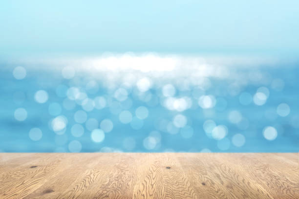 istock Blurred background seen through a wooden table with wood grain, depth background, ocean background image 1959243861