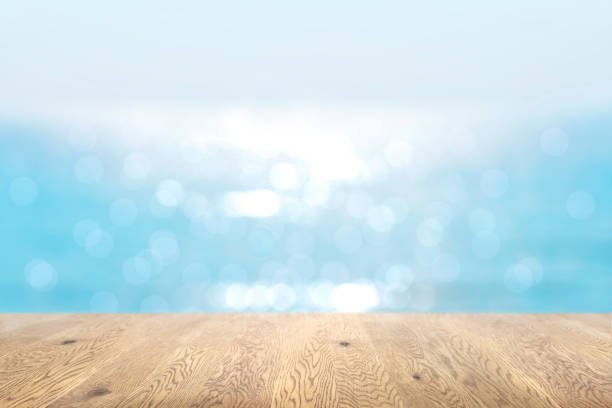 istock Blurred background seen through a wooden table with wood grain, depth background, ocean background image 1959244372