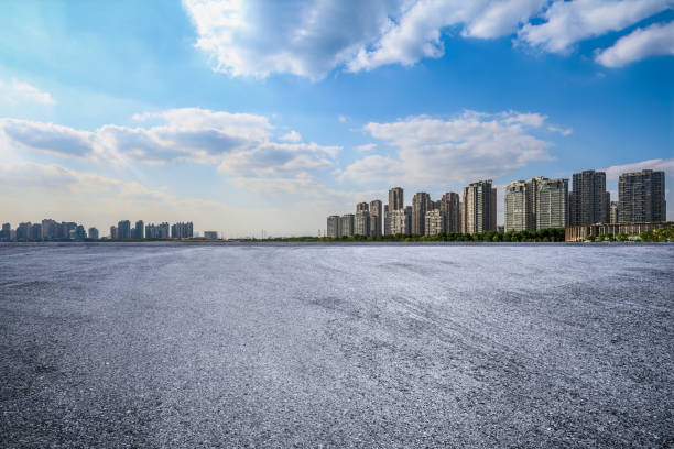 istock Empty asphalt road and city skyline background 1959260459