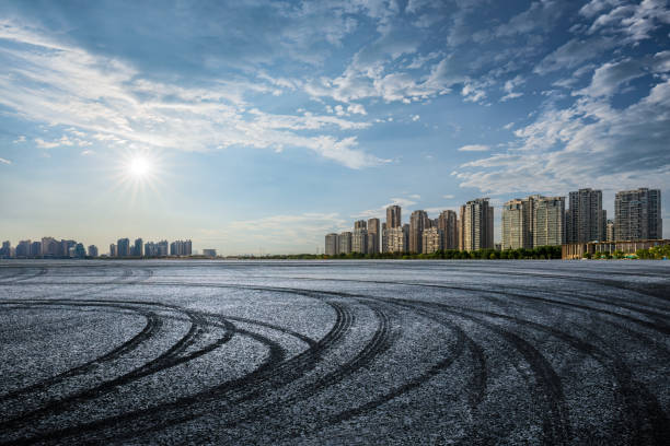 Abstract asphalt street road background with black tire marks on race track, Texture and background car automobile and automotive skid tire marks.