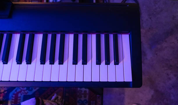 istock Piano keyboard in concert filled with light. selective focus modern piano, close up, studio light 1959305278