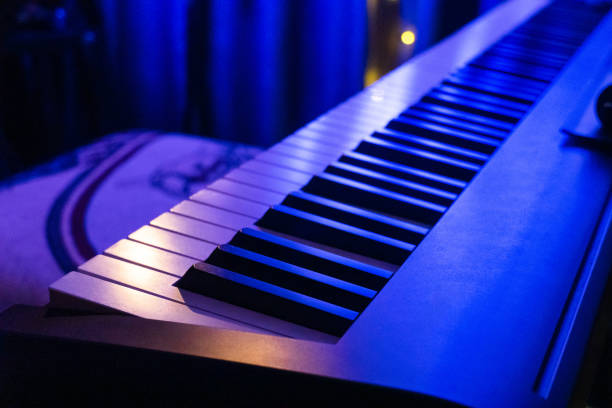 istock Piano keyboard in concert filled with light. selective focus modern piano, close up, studio light 1959305791