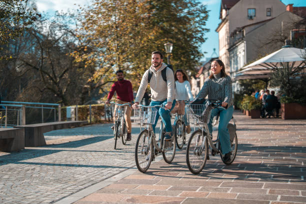 istock Diverse Friends Enjoying a Bicycle Ride in Urban Setting 1959306346