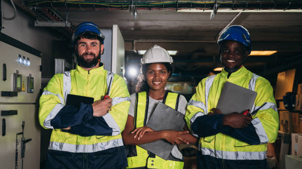 istock Team Engineers inspected the electrical switchboard and verified the operational voltage range. Technician setting electrical in inverter solar panel room 1959325122