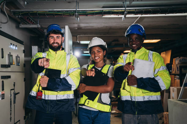 istock Team engineers and foreman stack hand and shake hands to show success at inverter solar panel room. Worker industry join hand for collaboration. 1959326173
