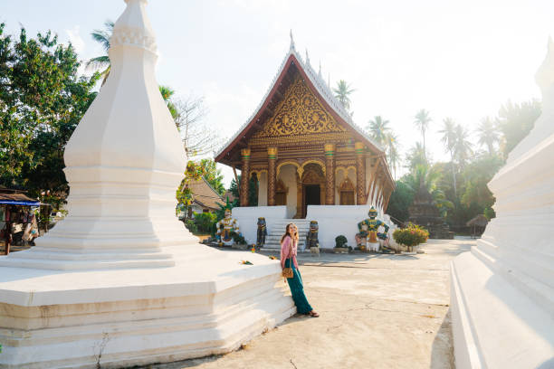 istock Woman exploring buddhist temple in Laos 1959326189