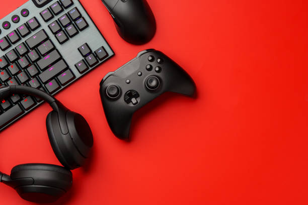 istock Computer keyboard and headphones on red background top view 1959326701