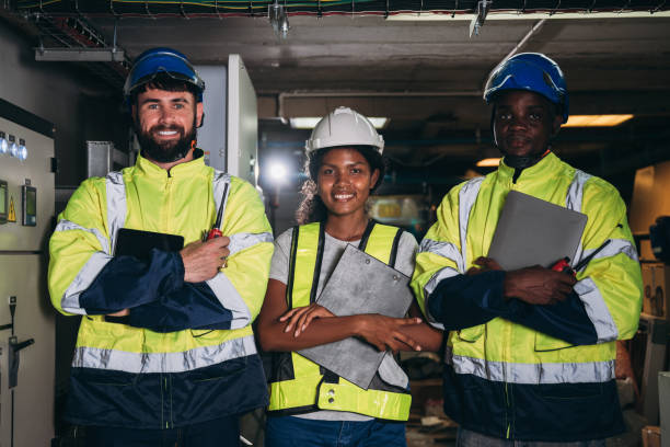istock Team Engineers inspected the electrical switchboard and verified the operational voltage range. Technician setting electrical in inverter solar panel room 1959331498