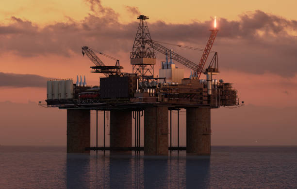 istock offshore oil rig in the ocean during sunset 1959344195