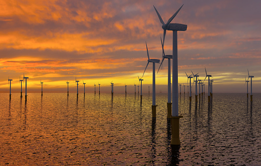 Offshore wind farm at sunset