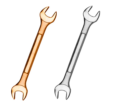 golden and silver wrenches isolated