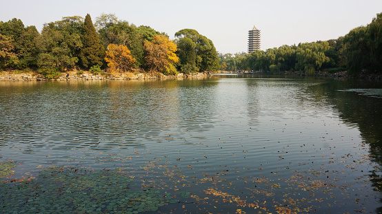 The Boya Tower on the Weiming Lake of Peking University is the symbol of the entire campus and a relic of the Old Summer Palace in the Qing Dynasty.