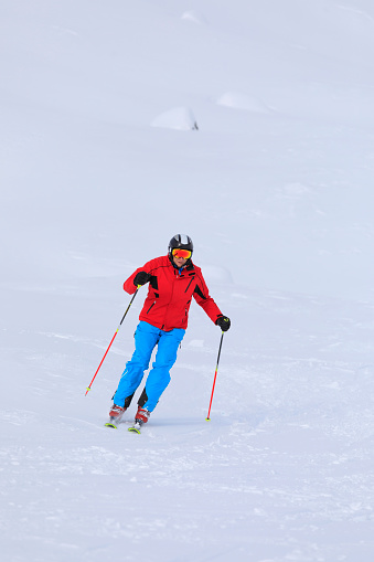 Back country skiing winter sport.  Vital senior men, Happy snow skier, enjoying on  powder snow and off piste, sunny ski resorts.  Snowcapped mountain  Dolomite super ski area. Ski resort. italy, Europe