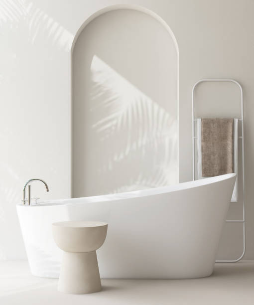 istock White round side table by bathtub in luxury design bathroom in sunlight, palm leaf shadow on wall 1959403963